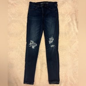 American Eagle Next Level Stretch Skinny Jeans: Size 8 (dark blue) with rips